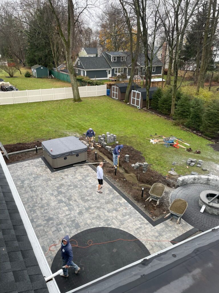 Backyard patio and stone landscaping installed by HM Construction in Garfield New Jersey