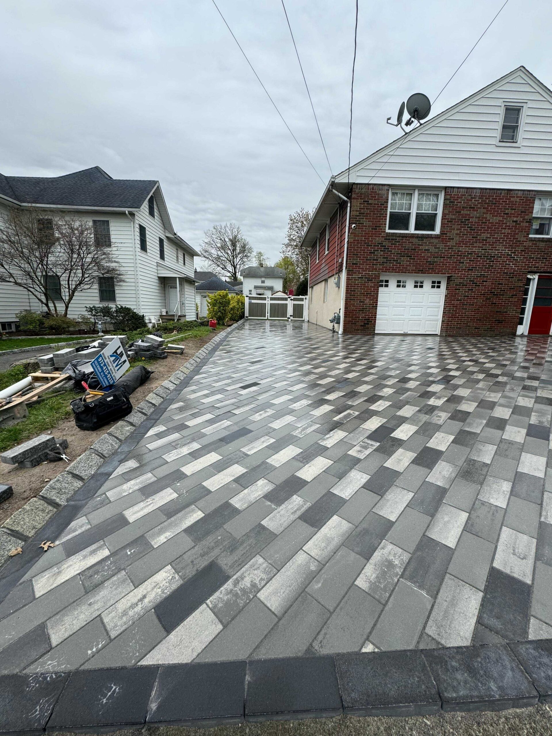 Gray paver driveway with dark border in Passaic NJ