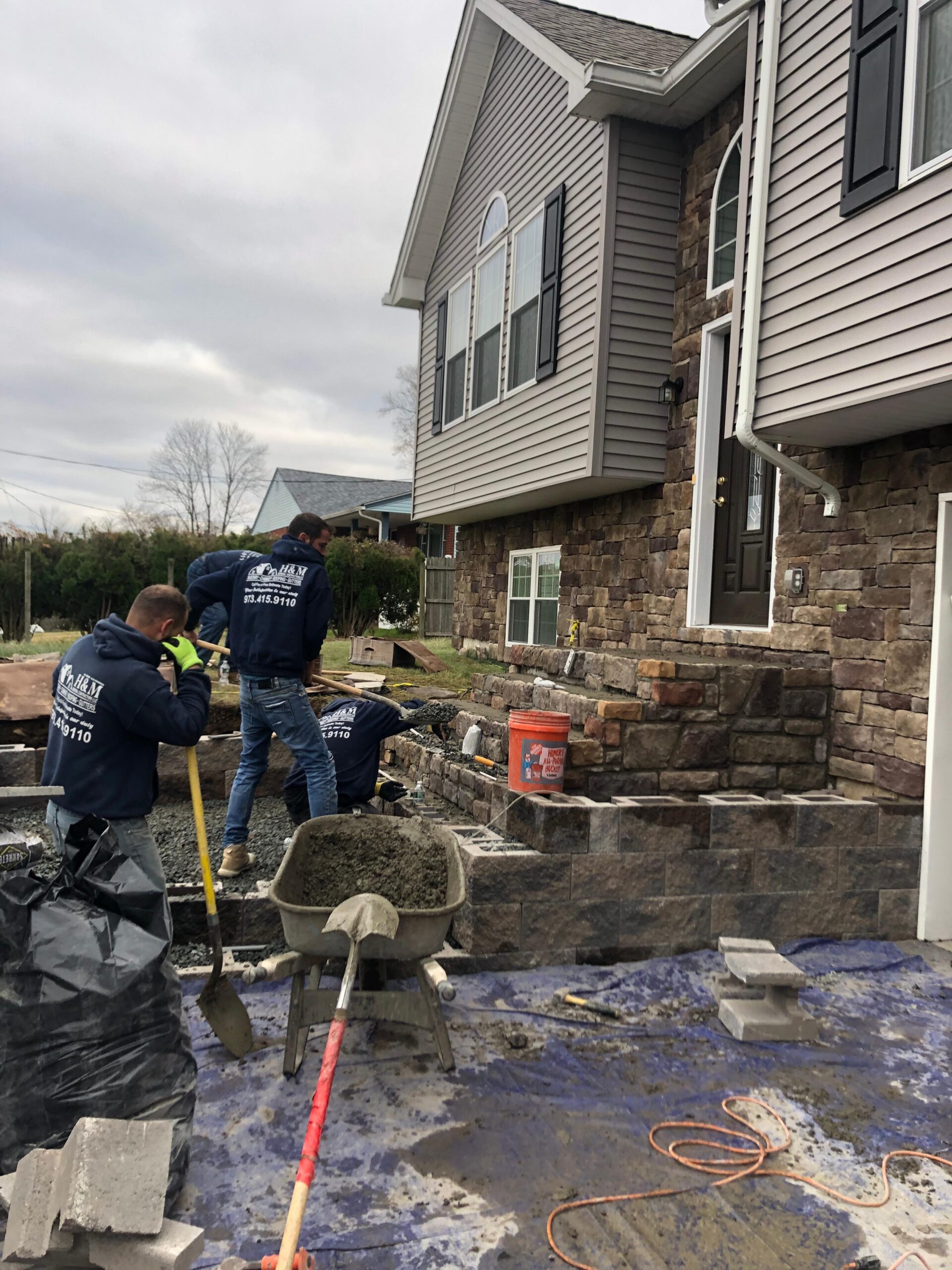 H&M Construction crew building custom masonry steps in New Jersey