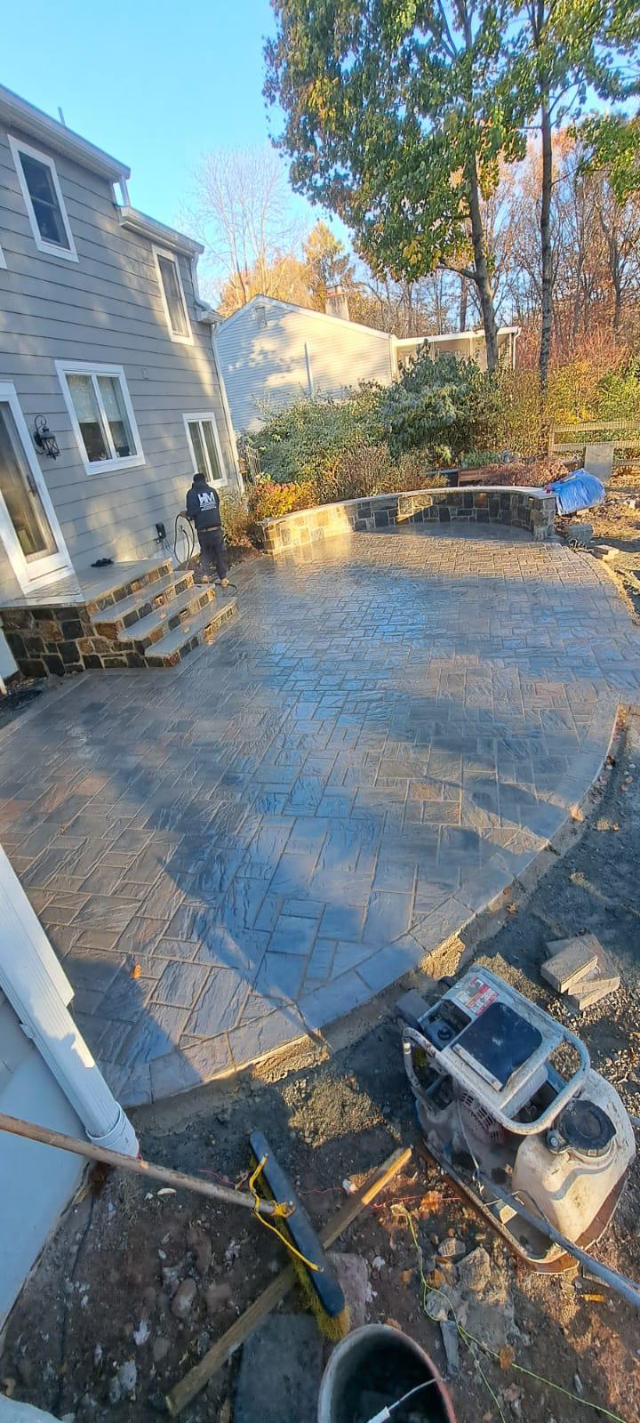 Backyard paver patio with stone steps in Morris Plains NJ