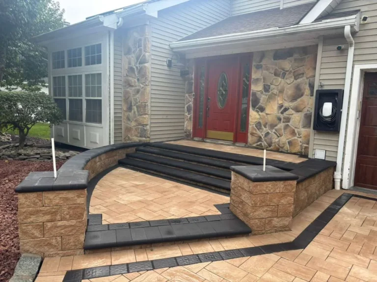urved paver front entrance with custom masonry steps