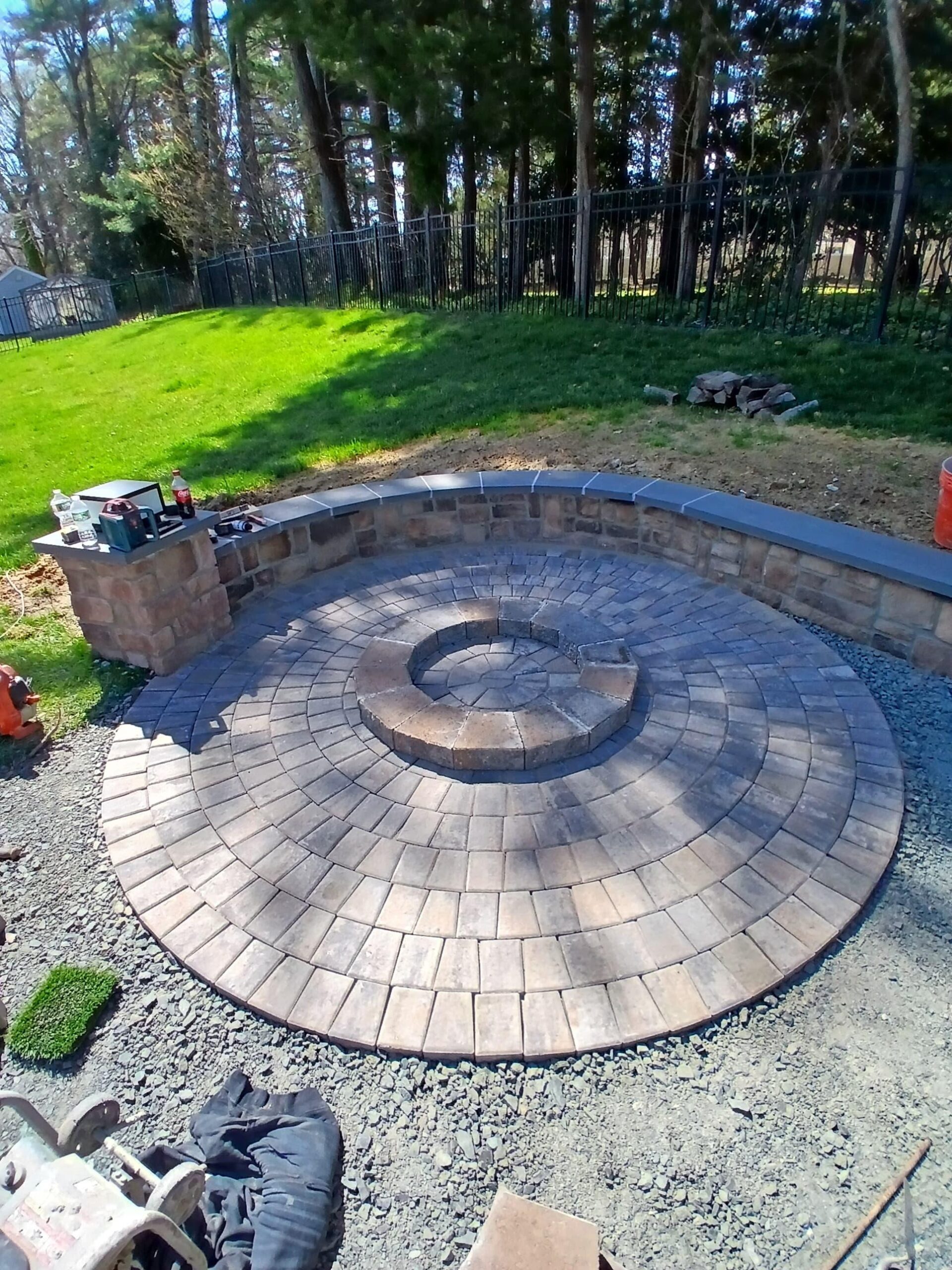 Round paver fire pit and outdoor living project in Millburn NJ
