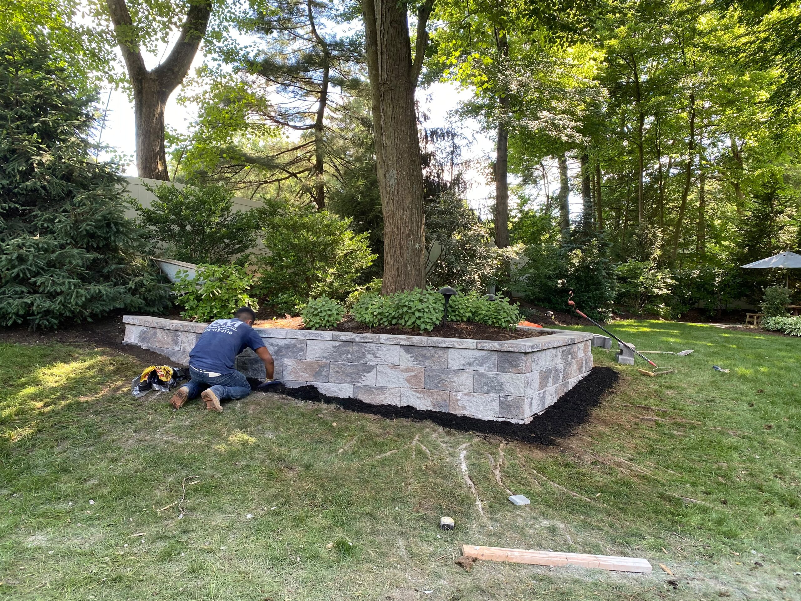 Retaining wall built into landscaped backyard