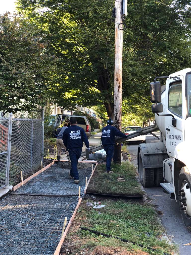 Concrete walkway base construction in progress