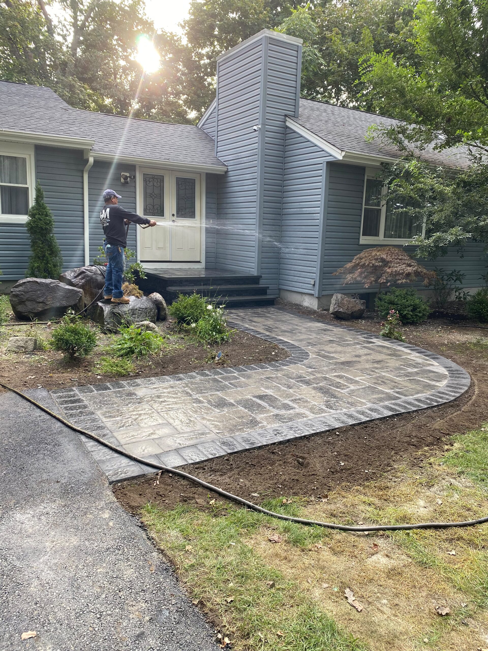 Curved paver walkway leading to front entrance in Oakland NJ