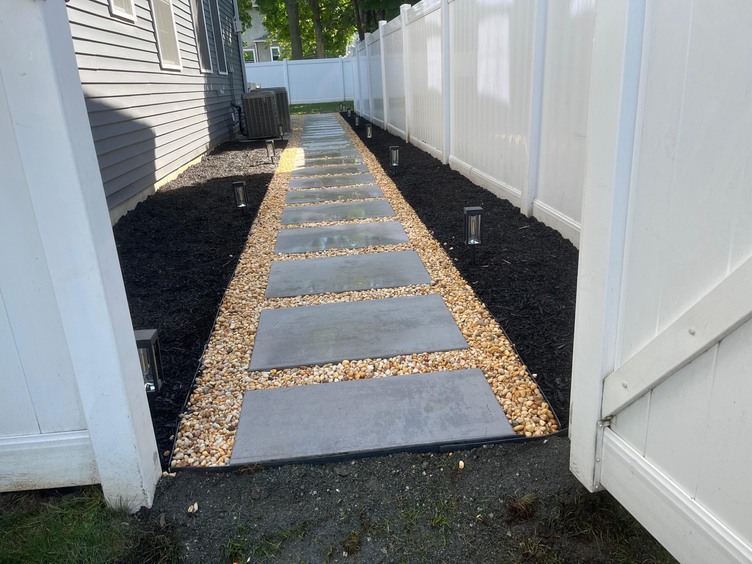 Modern stepping stone side yard walkway
