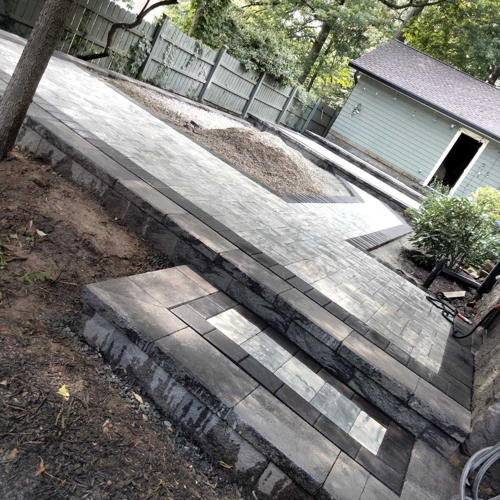 Raised paver patio with masonry steps in Morris Plains NJ