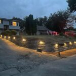 Finished retaining wall with landscape lighting in North Jersey