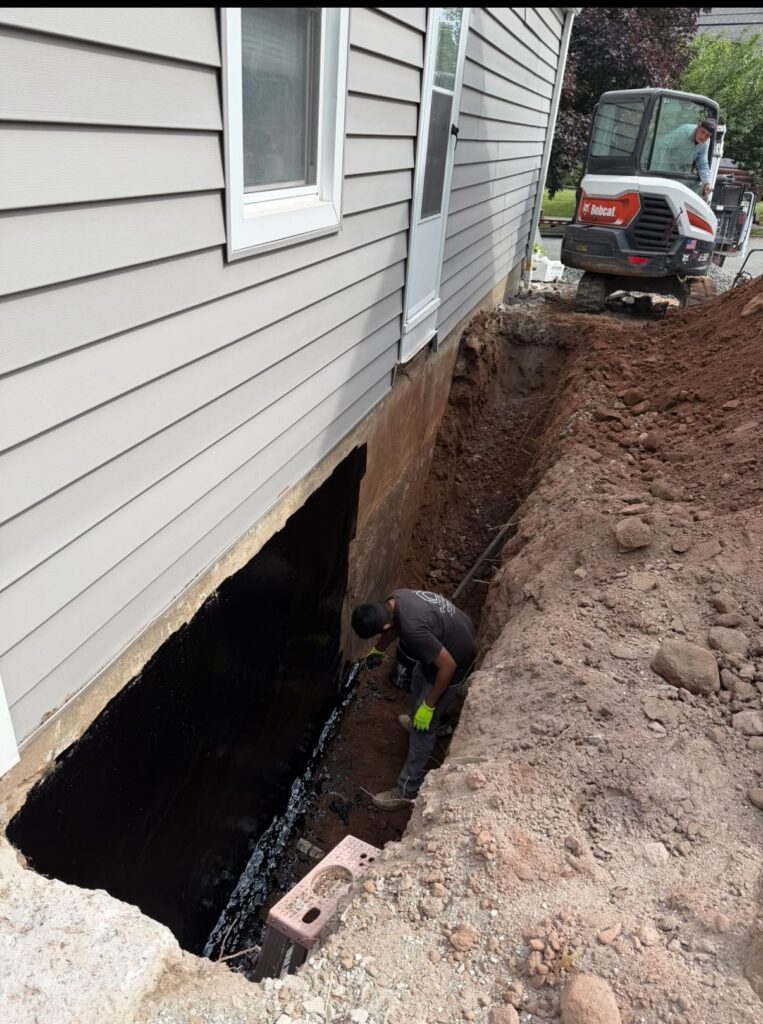 Exterior foundation waterproofing work in progress
