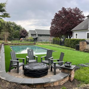 Backyard outdoor living patio with fire pit in Wall Township NJ