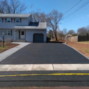 Asphalt driveway with paver border in New Jersey