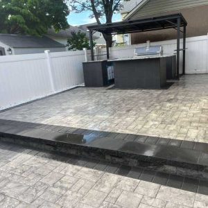 Backyard paver patio with outdoor kitchen