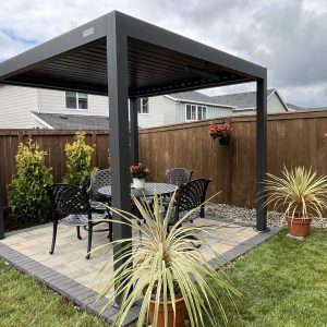 Backyard paver patio with modern pergola