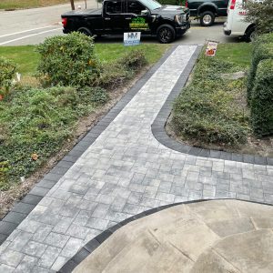 Gray paver walkway leading to front entrance in Lincoln Park NJ