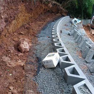 Retaining wall base and drainage preparation